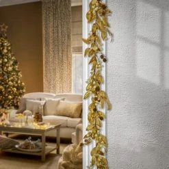 National Tree Company HGTV Home Collection 9ft Unlit Artificial Christmas Garland, Metallic Gold Laurel Leaves, Flexible Vine Base